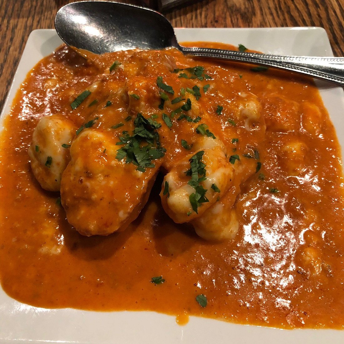 La Merenda signature dishes Butter Chicken, Argentinian Beef, Tres Leches Cake, Beef Empanadas, Patatas Bravas